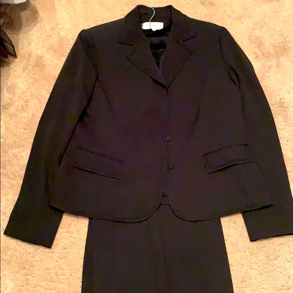 Black pantsuit with a matching blouse.